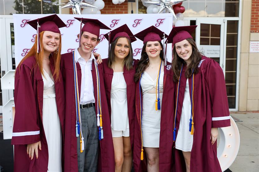 Graduates wearing maroon robes